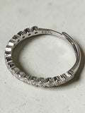 reveriebygemma adjustable half-eternity pavé ring in 925 sterling silver with cubic zirconia stones