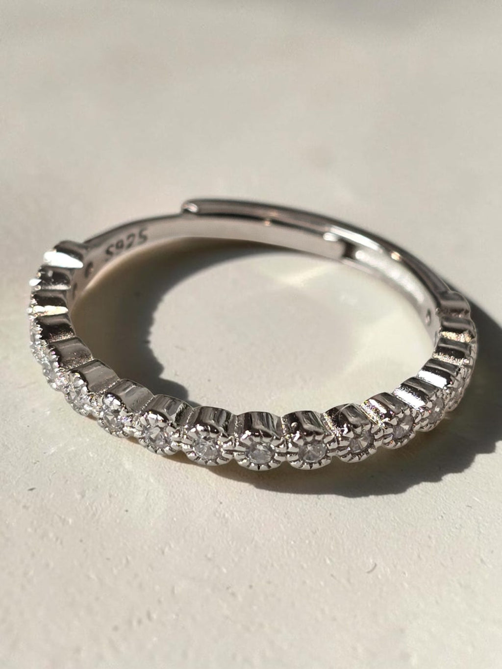 reveriebygemma adjustable pavé eternity ring in 925 sterling silver with sparkling cubic zirconia stones.