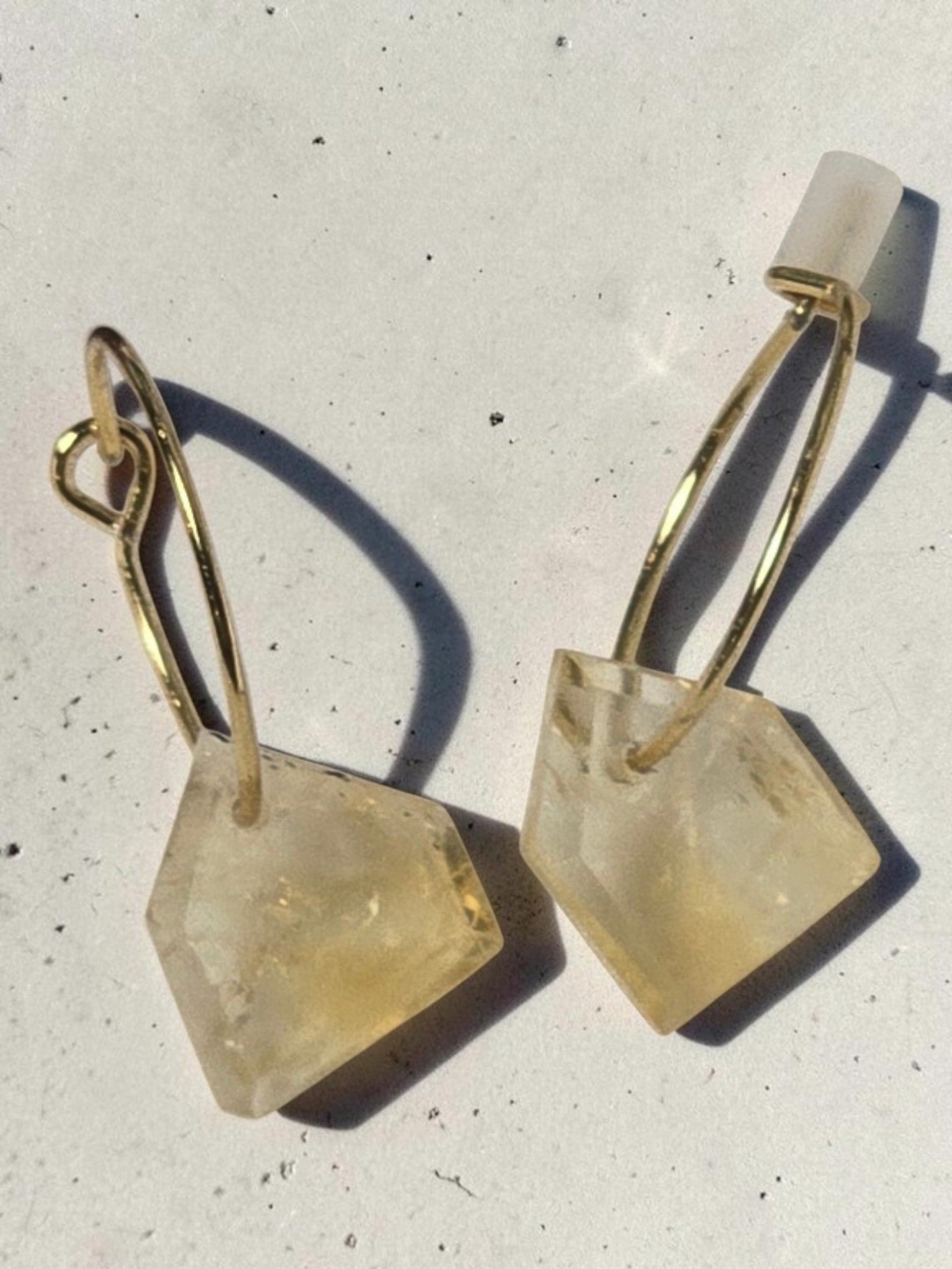 reveriebygemma Citrine Droplet Mini Hoops featuring raw-cut geometric citrine gemstones on gold-plated huggie earrings.