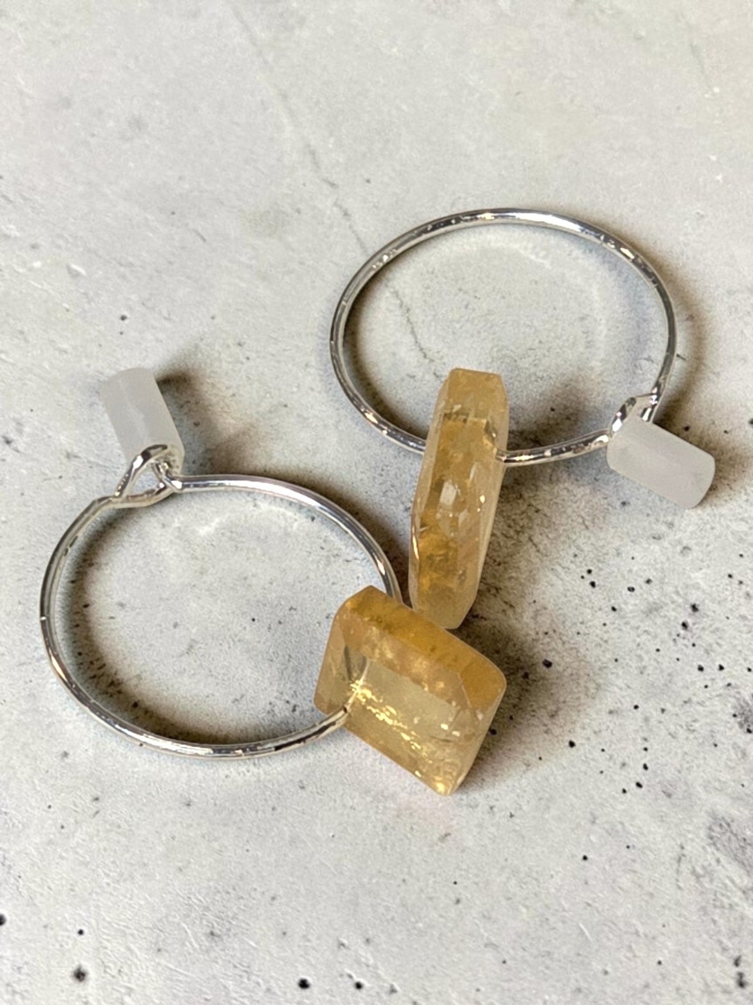 reveriebygemma sterling silver mini hoop earrings featuring raw-cut geometric citrine gemstone droplets.
