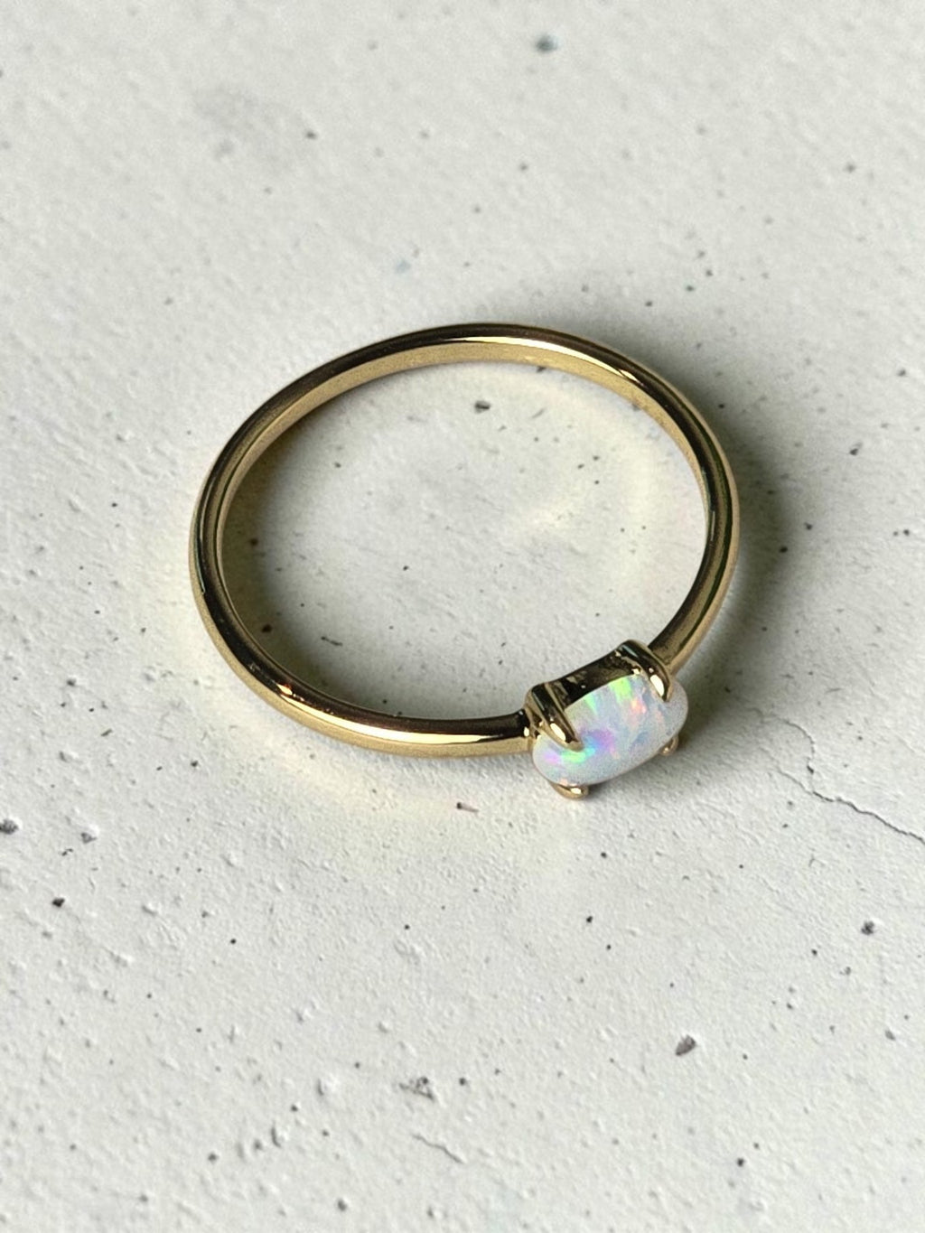 reveriebygemma 14kt gold plated stacking ring featuring a luminous lab-created fire opal on a slender polished band.