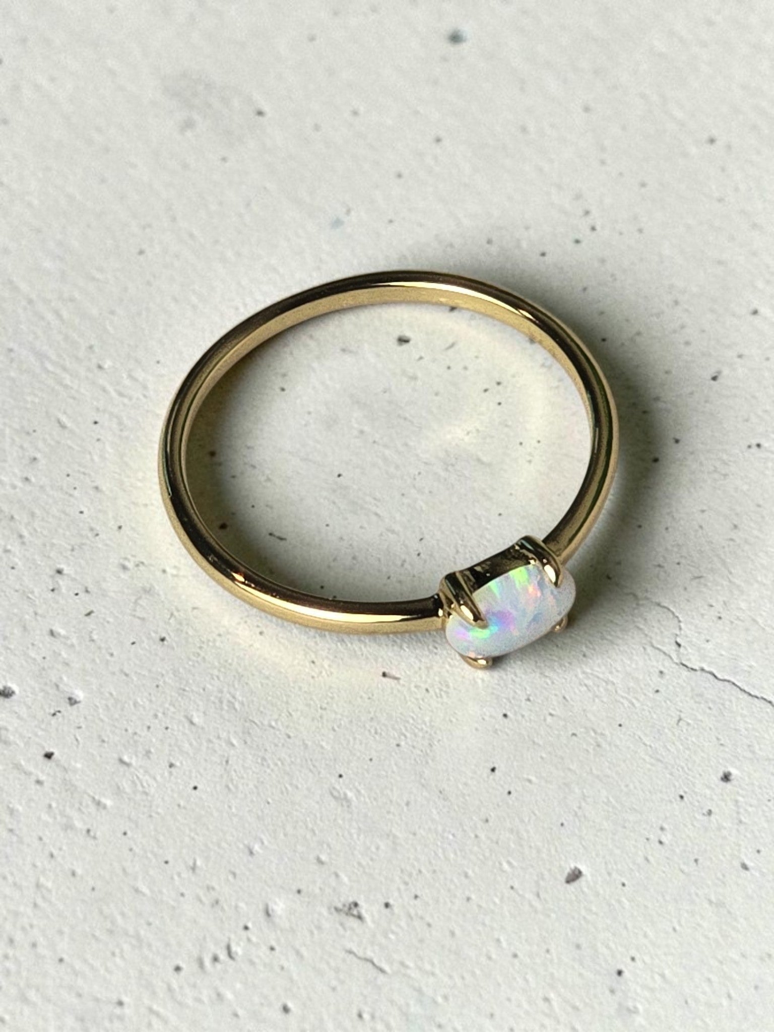 reveriebygemma 14kt gold plated stacking ring featuring a luminous lab-created fire opal on a slender polished band.