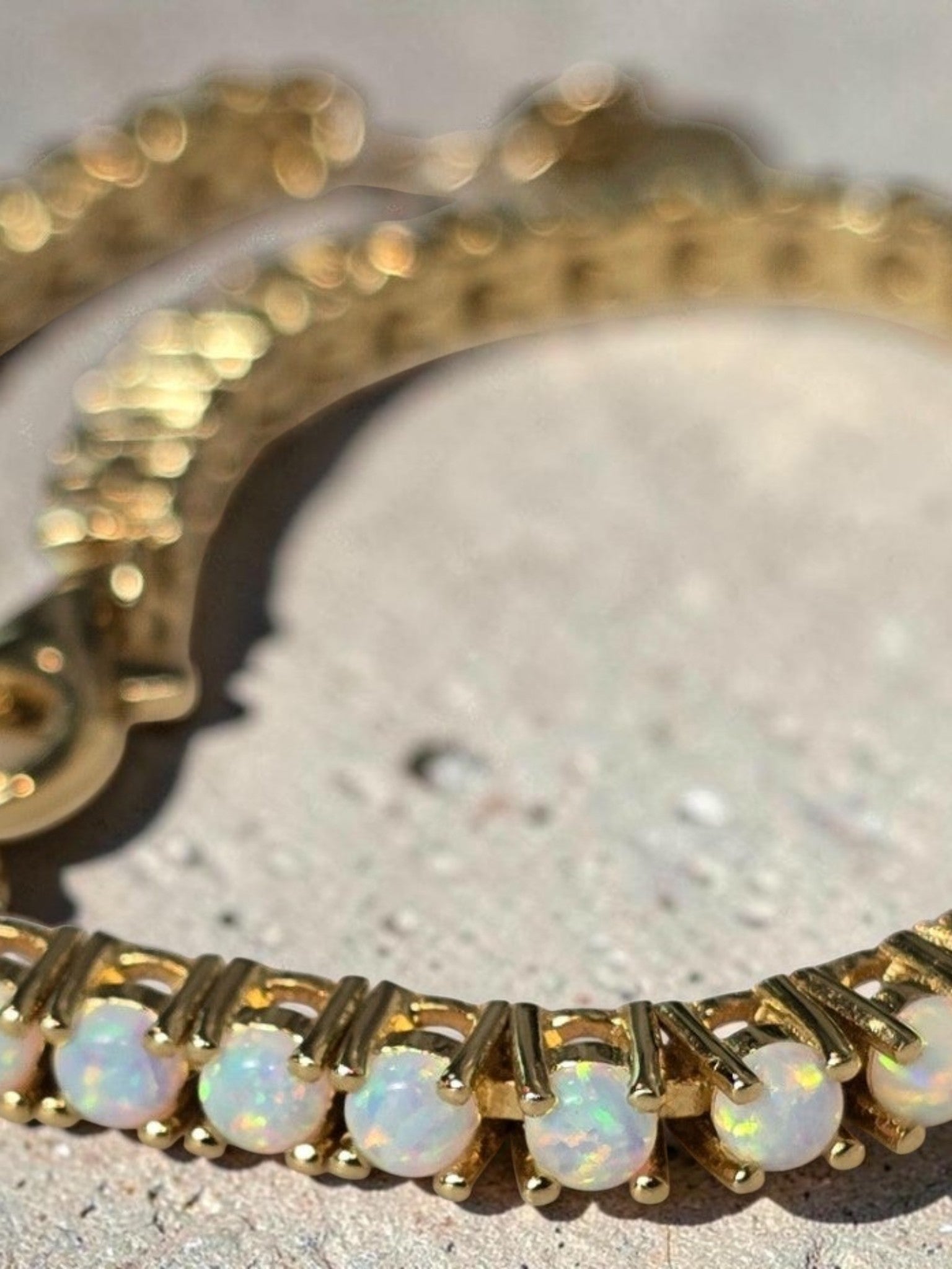 reveriebygemma fire opal tennis bracelet in 14kt gold plated sterling silver with round prong-set opals