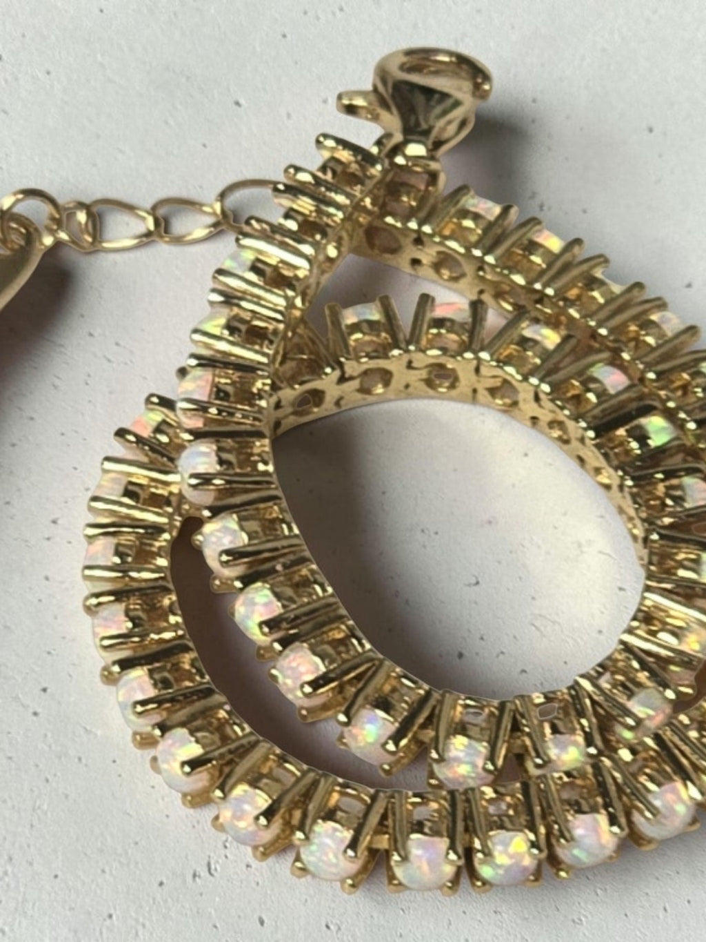 reveriebygemma fire opal tennis bracelet in 14kt gold plated sterling silver with round cut opals and heart charm