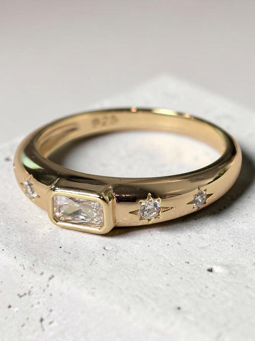 reveriebygemma 14kt gold plated sterling silver dome signet ring with a baguette CZ stone and starburst accents