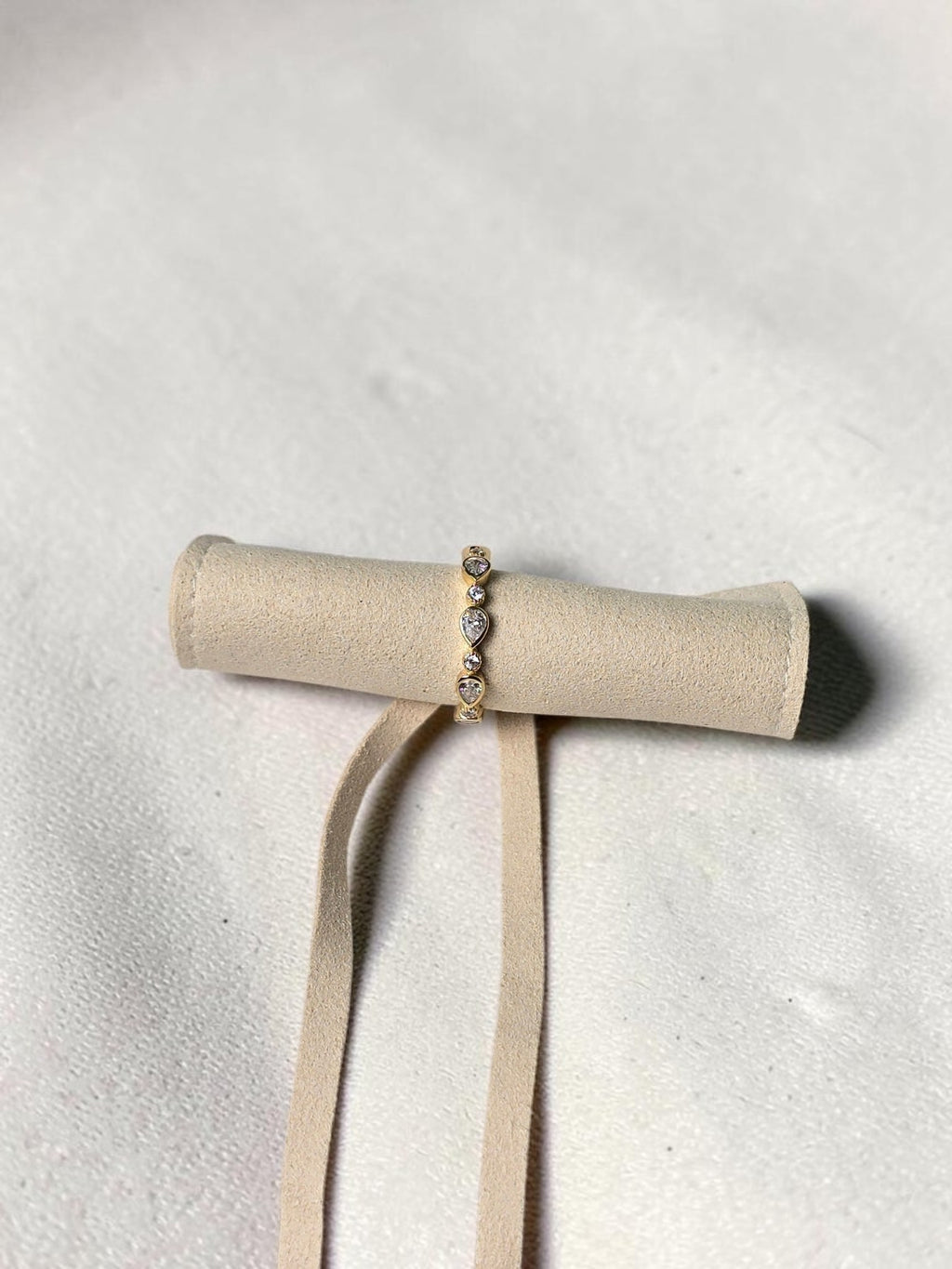 reveriebygemma gold plated sterling silver stacking ring with pear and round cubic zirconia in bezel settings