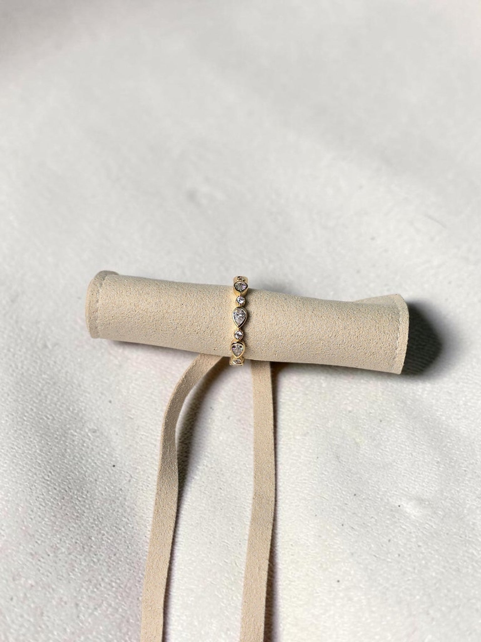 reveriebygemma gold plated sterling silver stacking ring with pear and round cubic zirconia in bezel settings