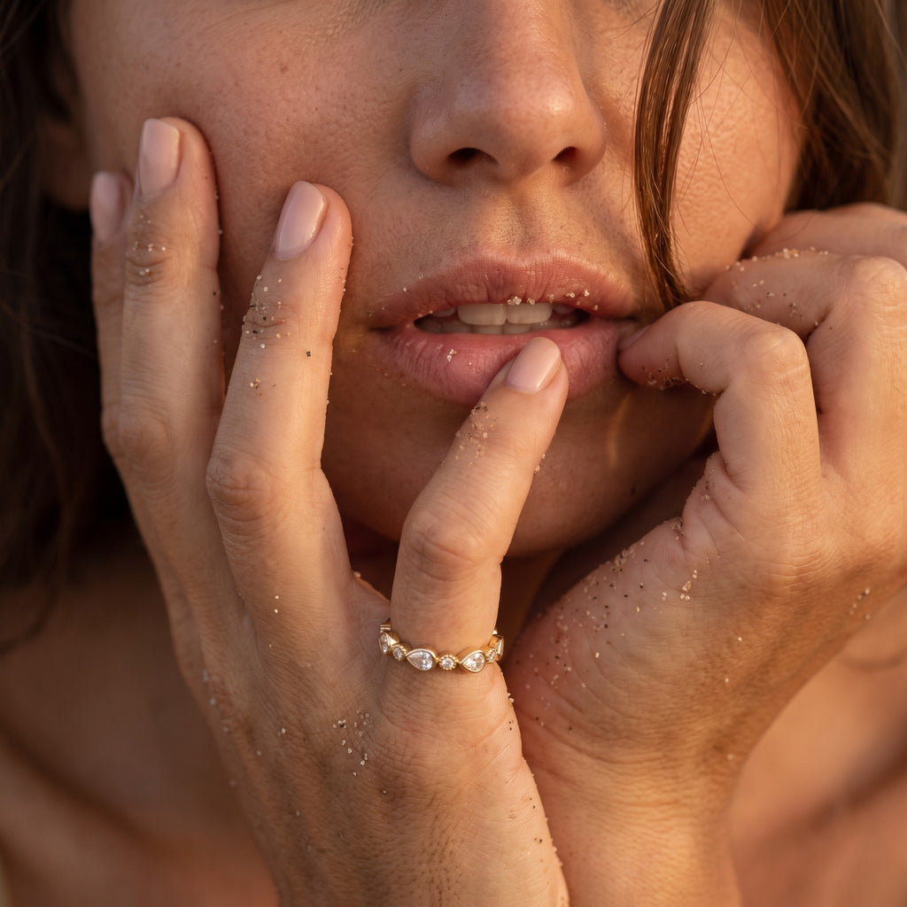reveriebygemma gold plated sterling silver stacking ring with pear and round bezel set cubic zirconia on a model