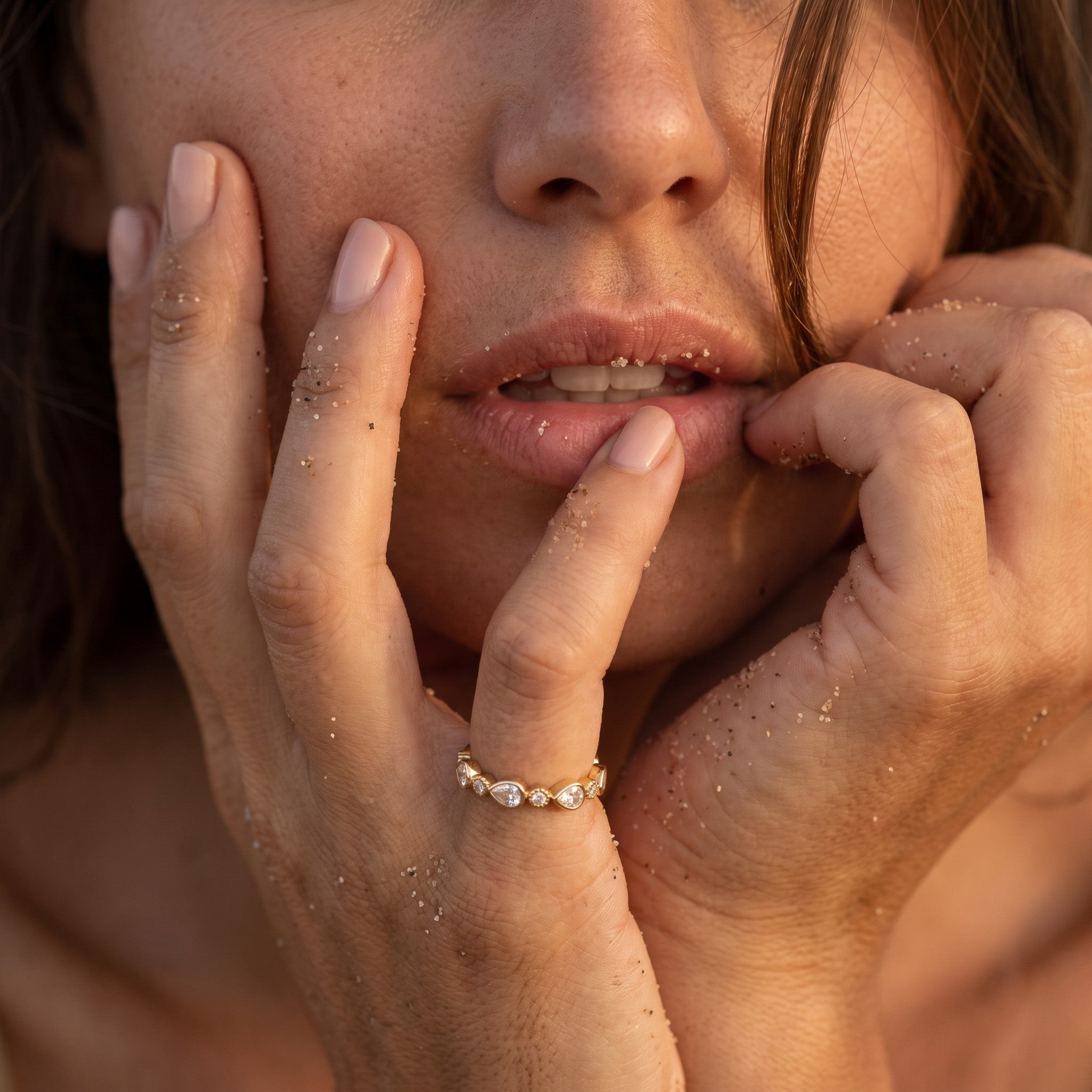 reveriebygemma gold plated sterling silver stacking ring with pear and round bezel set cubic zirconia on a model