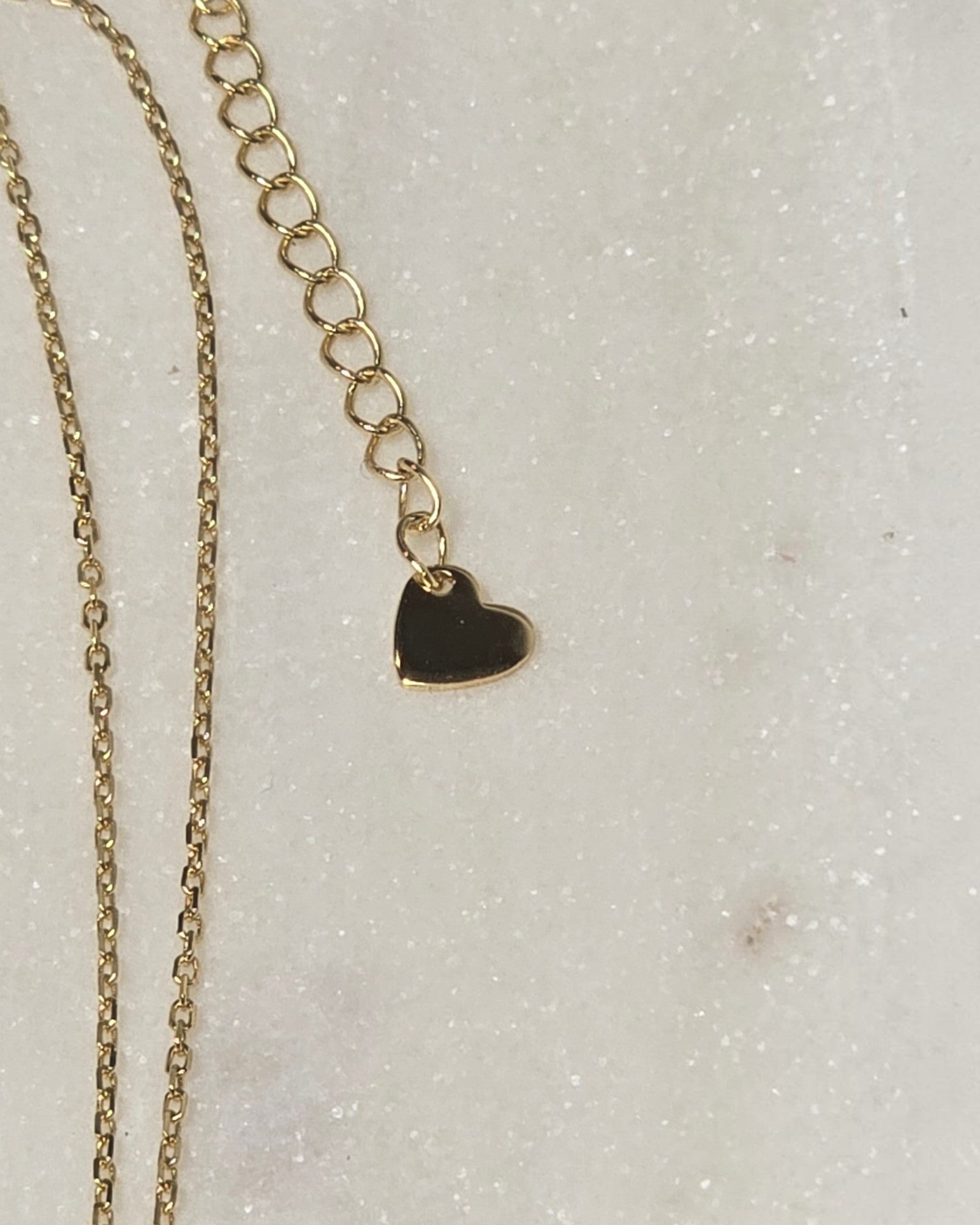 reveriebygemma gold plated sterling silver necklace chain extender with a small heart charm detail