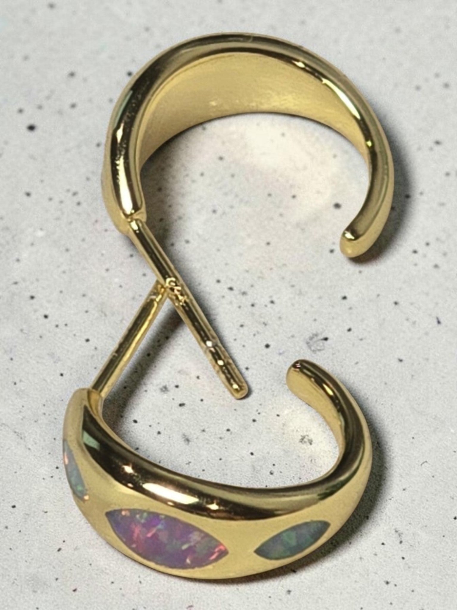 reveriebygemma 18kt gold vermeil huggie hoops featuring marquise-shaped iridescent opal inlays on a white surface