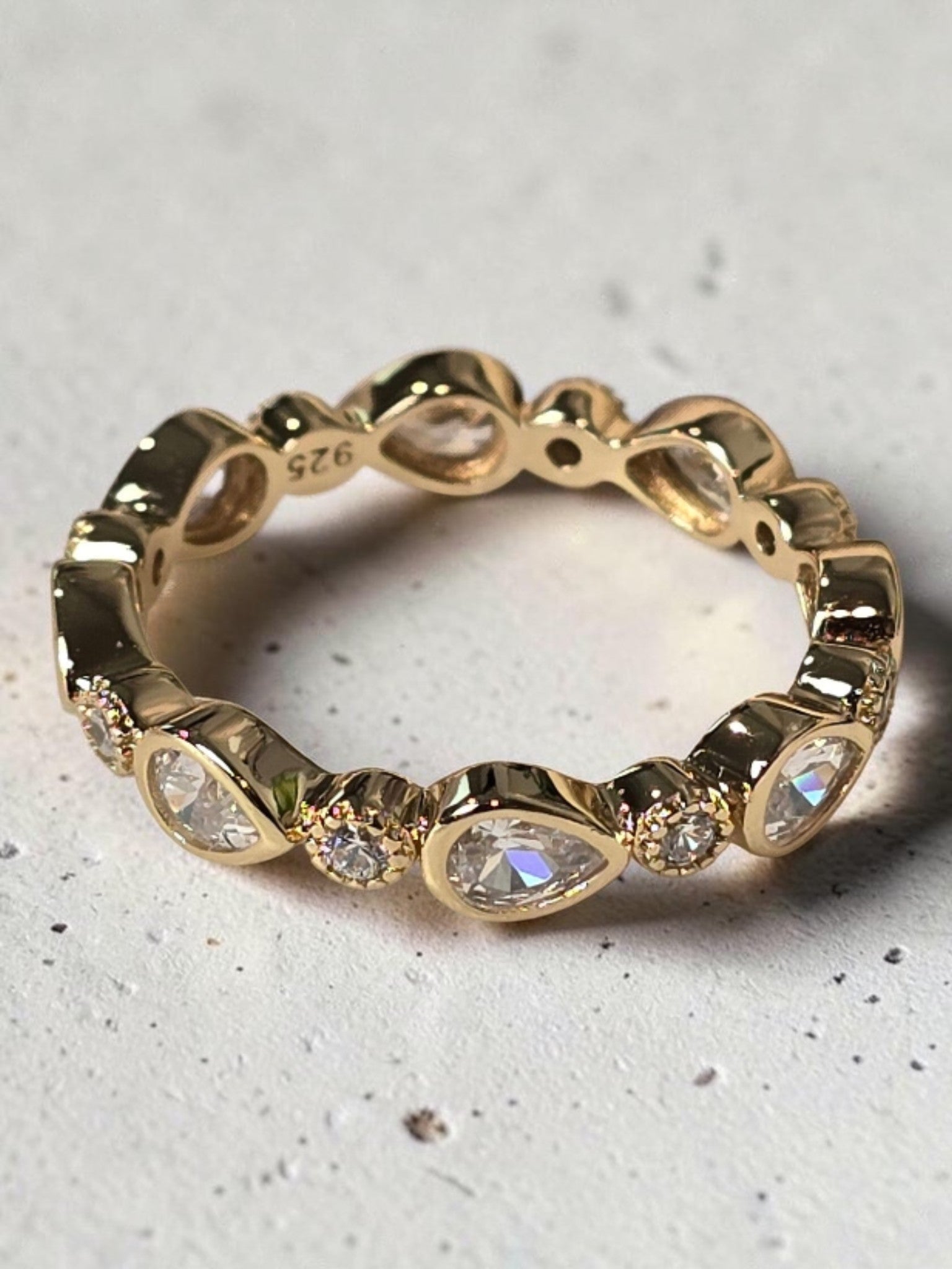 reveriebygemma gold plated sterling silver stacking ring with pear and round cubic zirconia in bezel settings