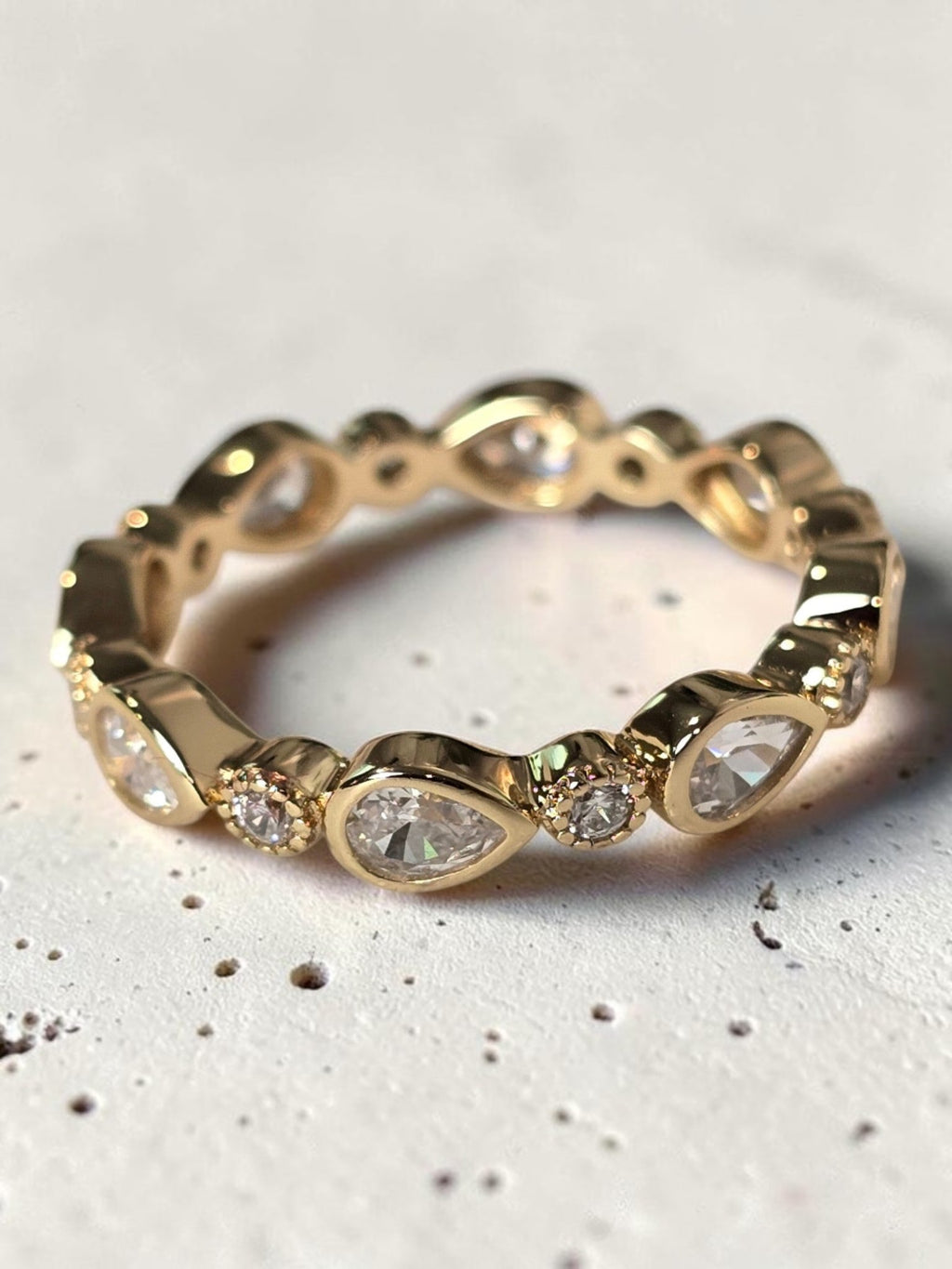reveriebygemma gold plated sterling silver stacking ring with pear and round bezel-set cubic zirconia stones