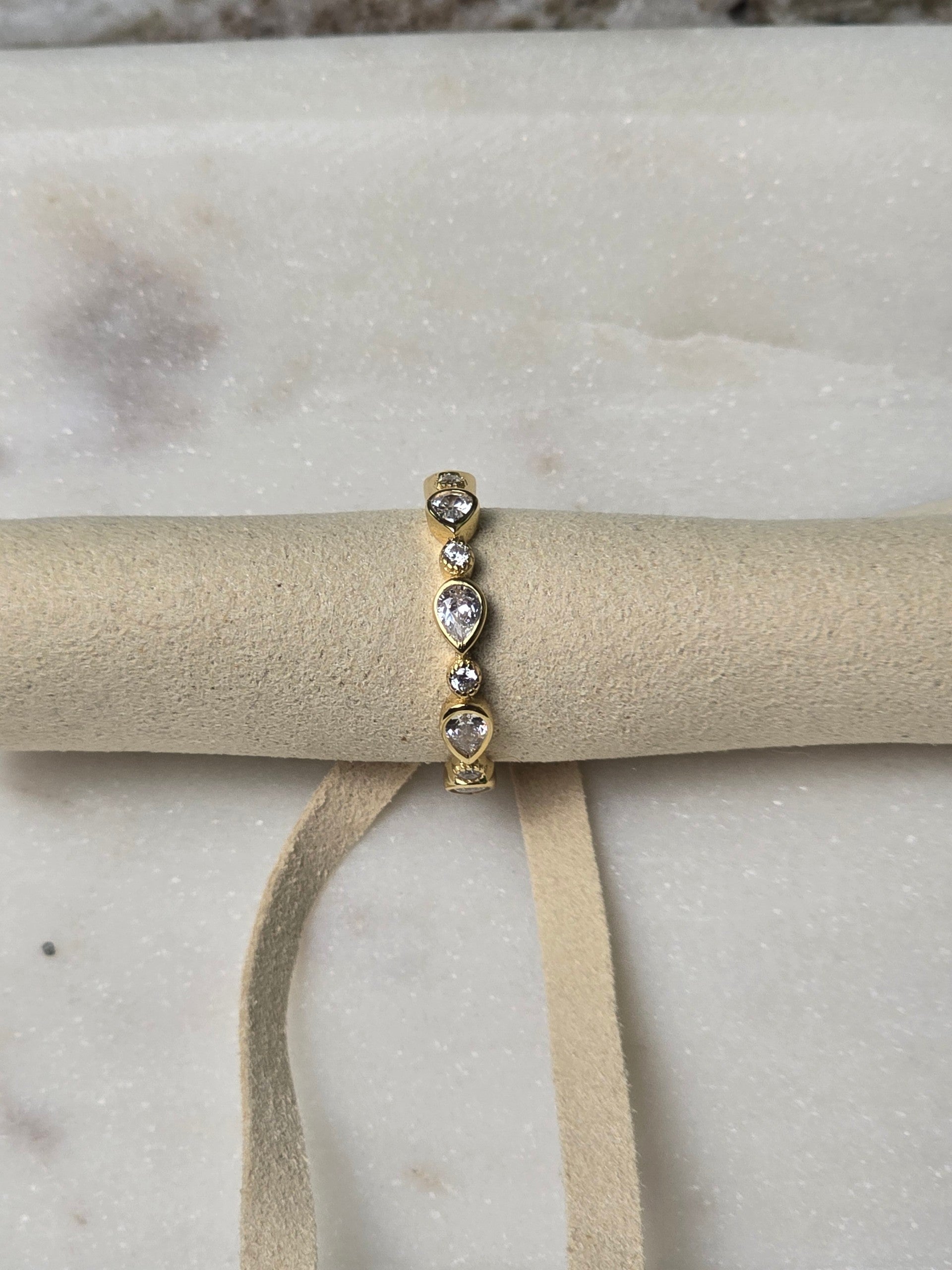 reveriebygemma gold plated sterling silver stacking ring with pear and round bezel set cubic zirconia stones