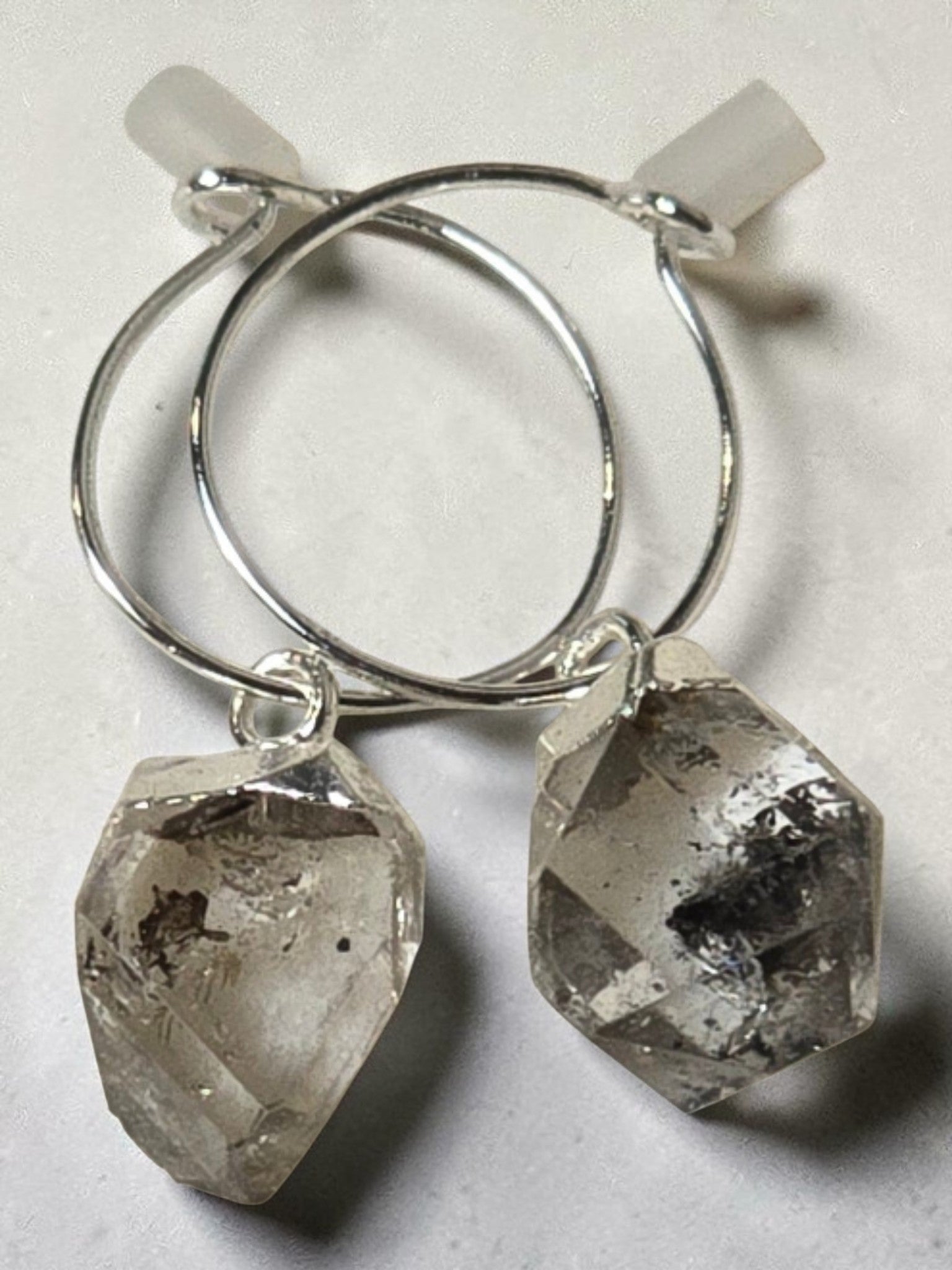 reveriebygemma sterling silver mini hoop earrings featuring raw-cut Herkimer diamond quartz crystal drops.