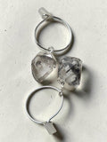 reveriebygemma sterling silver mini hoop earrings featuring raw-cut Herkimer diamond quartz crystals on a light surface