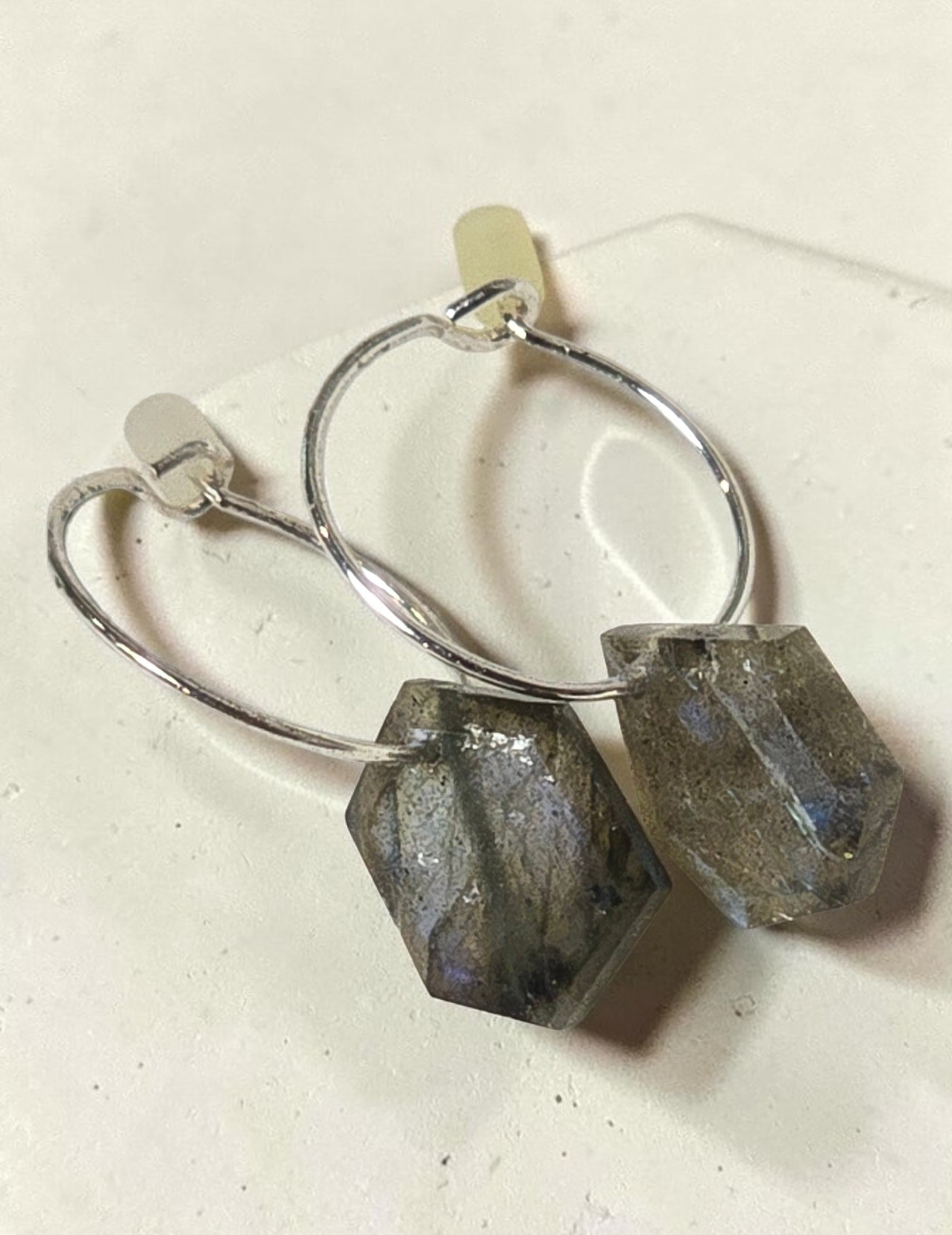 reveriebygemma sterling silver huggie earrings with geometric labradorite gemstone drops showing iridescent flashes