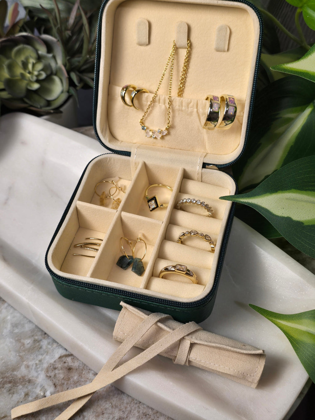 reveriebygemma Labradorite geometric drop huggie earrings displayed in a green velvet jewelry travel organizer case
