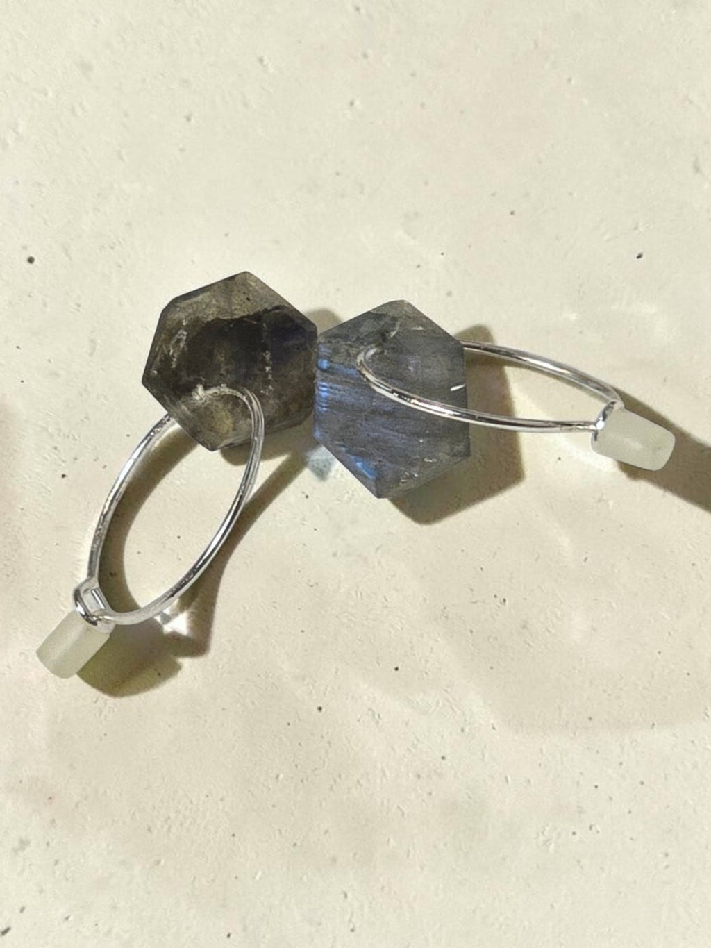 reveriebygemma sterling silver huggie earrings with geometric labradorite stone drops showing iridescent blue flash