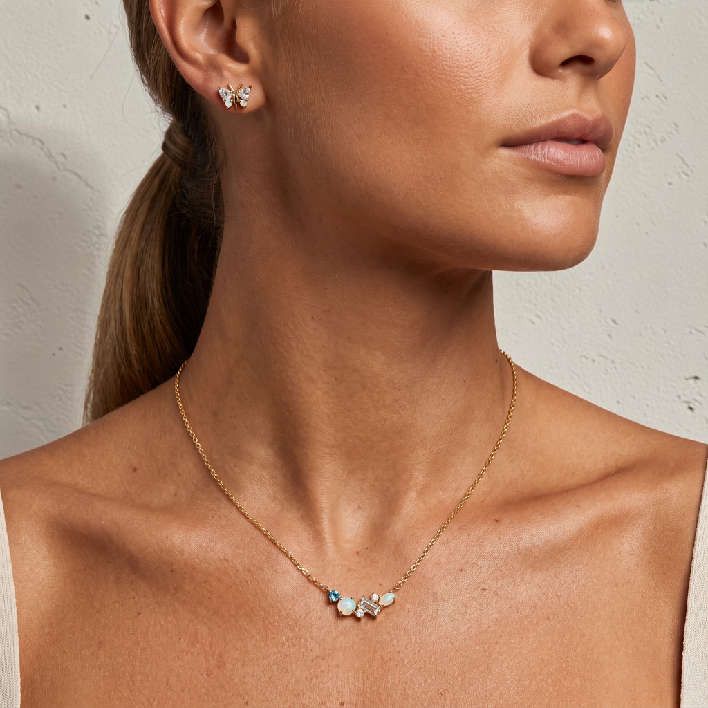 reveriebygemma 18kt gold vermeil necklace featuring an asymmetrical cluster of rainbow moonstone and London blue topaz