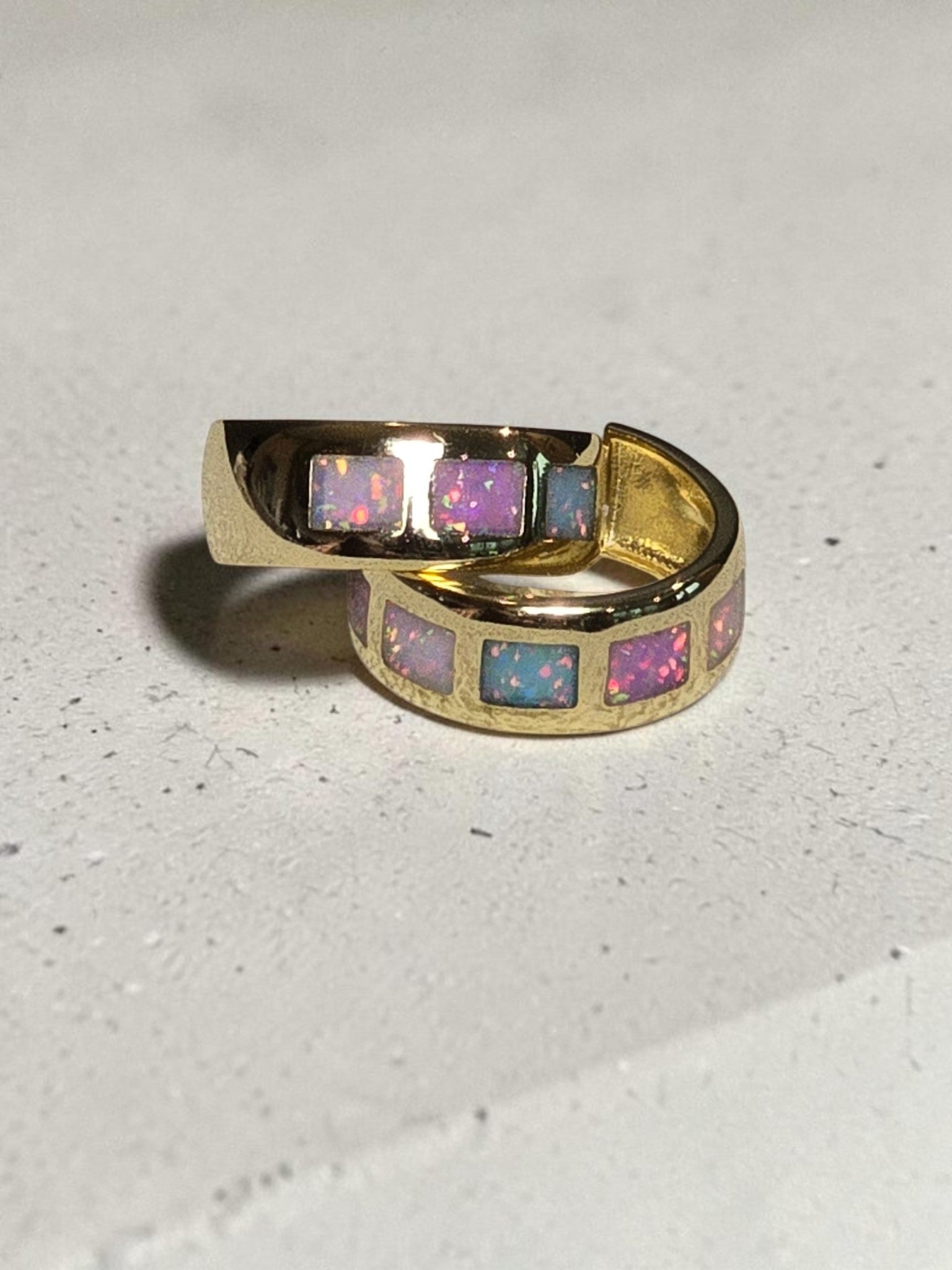 reveriebygemma 18kt gold vermeil hoop earrings featuring square-cut iridescent opal inlays in a vibrant ombré pattern.