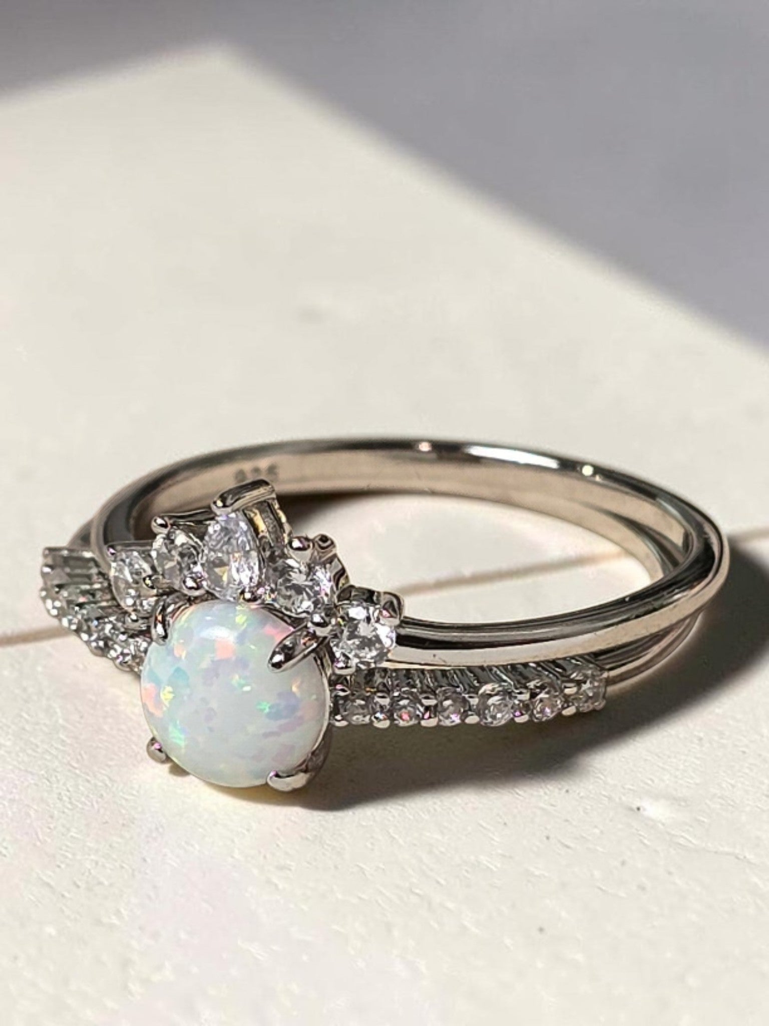 reveriebygemma opal tiara stacking ring set in rhodium plated sterling silver with a pear-cut CZ crown and pavé band