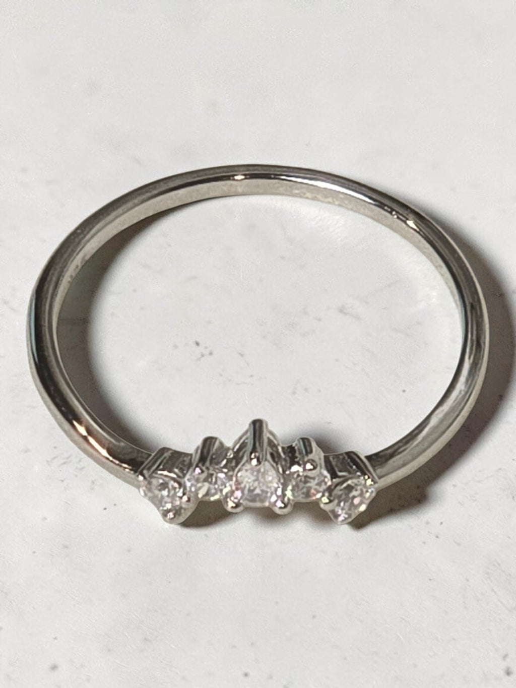 reveriebygemma rhodium plated sterling silver pavé tiara ring with pear and round cut cubic zirconia accents