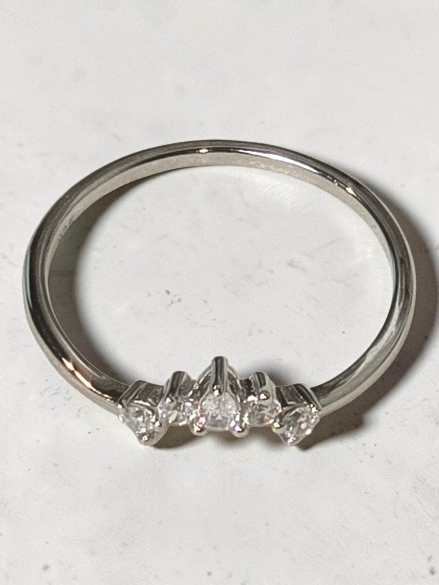 reveriebygemma rhodium plated sterling silver pavé tiara ring with pear and round cut cubic zirconia accents